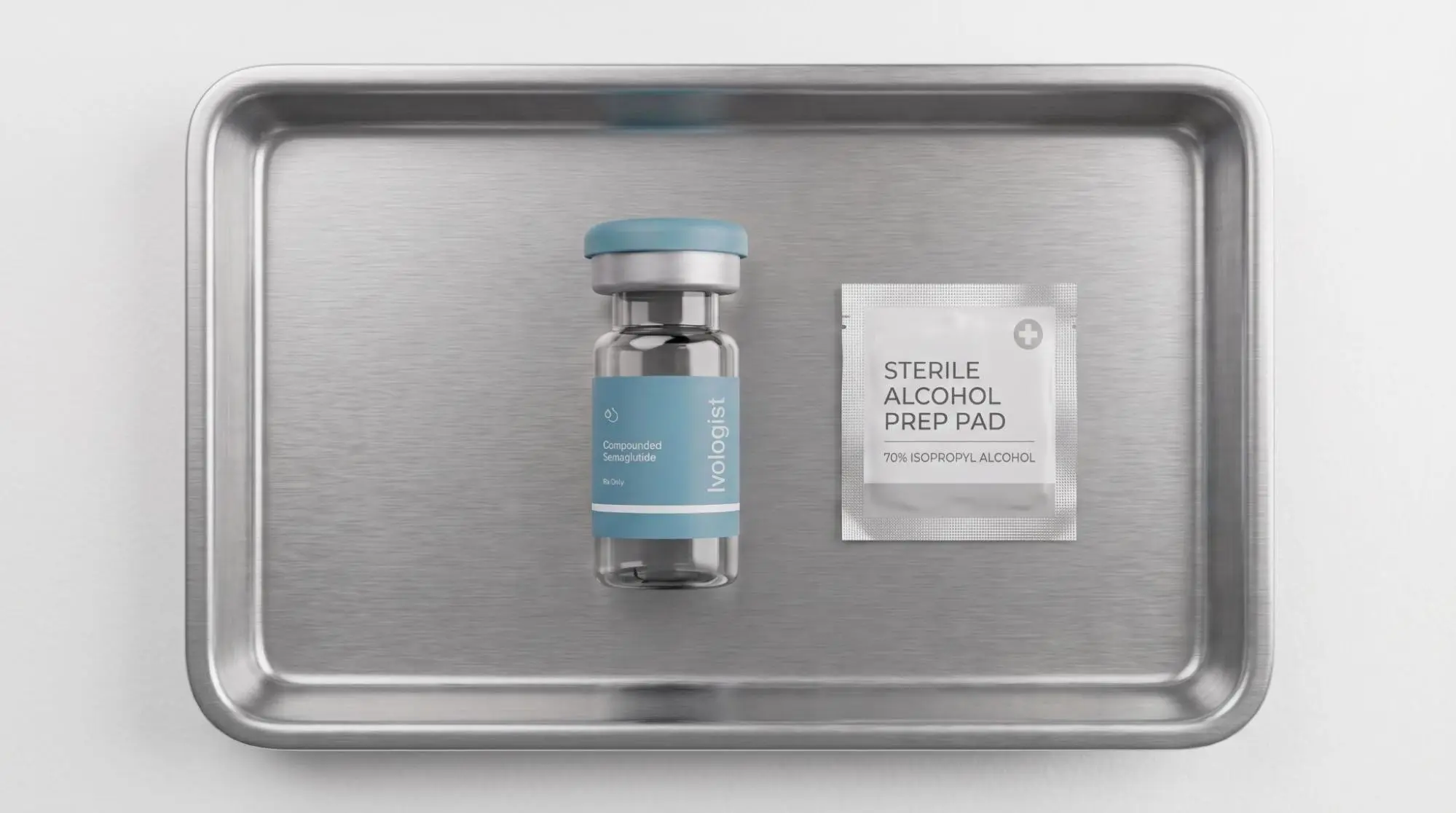 A vial of compounded semaglutide and a sterile alcohol prep pad on a metal tray