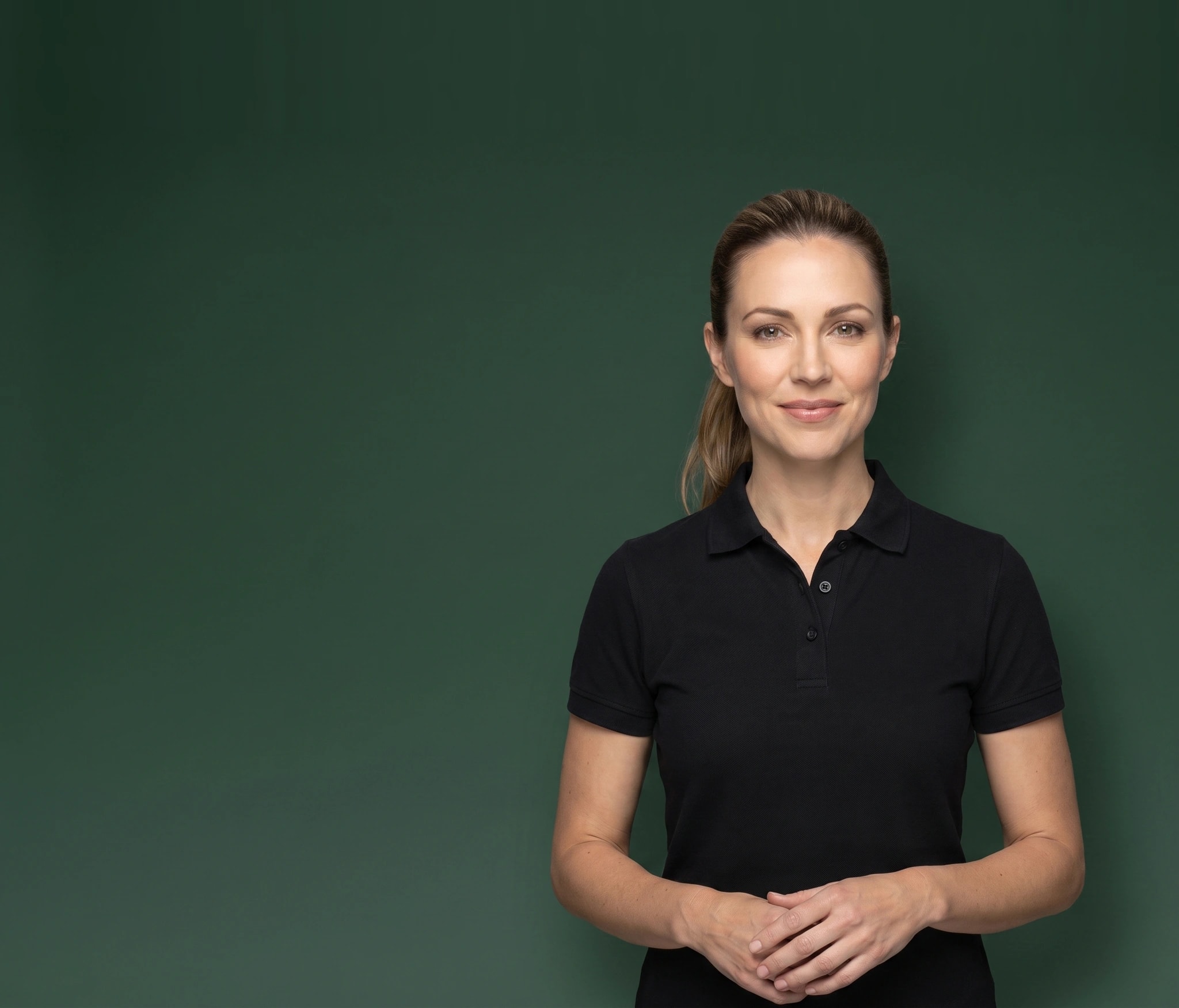 Health coach in a black polo smiling