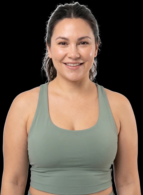 Woman in activewear smiling confidently